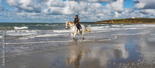 Horse rider on the beach at Anglesey 