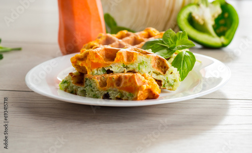 cooked two-color vegetable waffles made from cabbage and carrots.