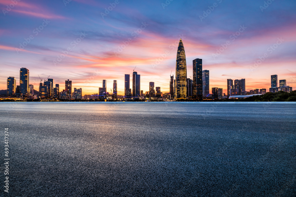 Obraz premium Asphalt road and urban skyline with modern buildings at sunset in Shenzhen, Guangdong Province, China.