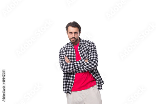 young caucasian handsome guy with a beard and styled hair on a white background with copy space © Ivan Traimak