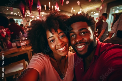A young happy loving black couple celebrates Valentine's Day at a holiday party.