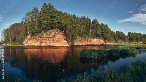 Red rocks near Salaca, clear blue sky, orange sandstone, calm river Salaca photo