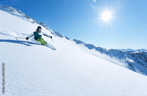 wonderful skiing in perfect powder snow condition in the Alps on a sunny day.