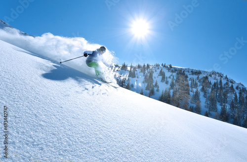 wonderful skiing in perfect powder snow condition in the Alps on a sunny day.