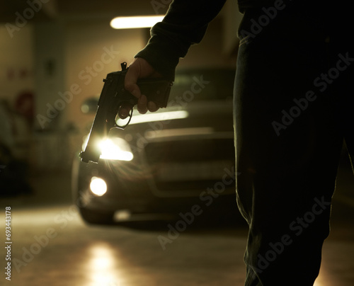Photography Person, hand and gun for car hijack in parking lot for victim abduction for ransom, robbery or scary violence