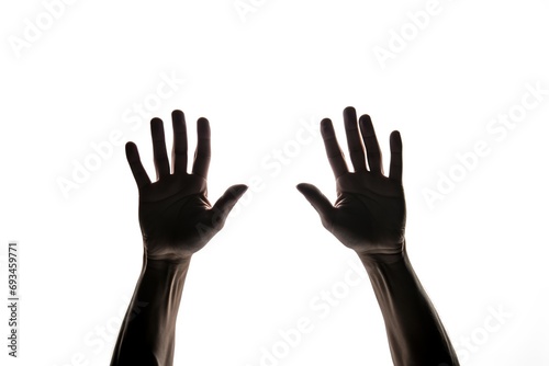 Dark silhouette hands behind glass on white background