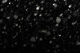 Bokeh effect of snowfall and lights. Abstract blurred background with snowflake in the night sky, White spots and dots in the dark. Snowy stormy weather, falling snow