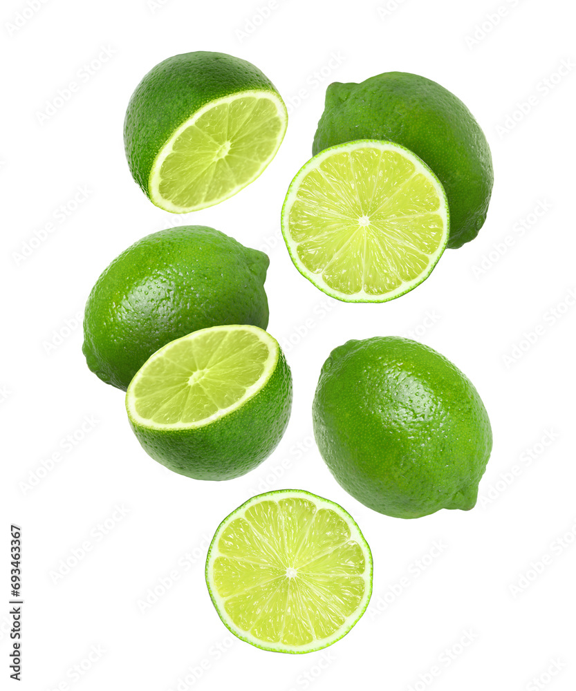 Fresh ripe limes falling on white background