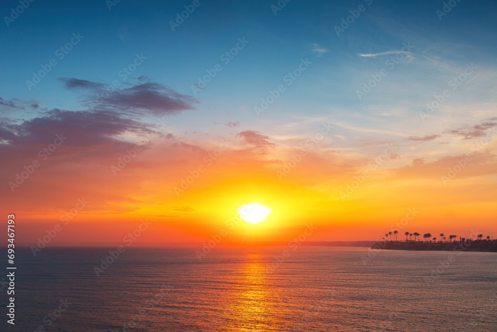 Beautiful sunrise over the sea waves and coast