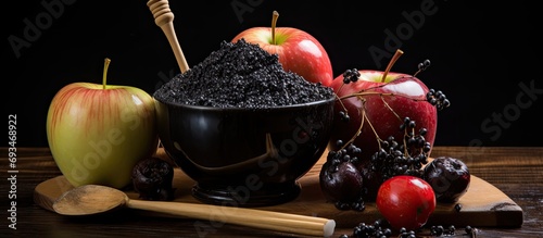 Ingredients for DIY black candied apples. photo