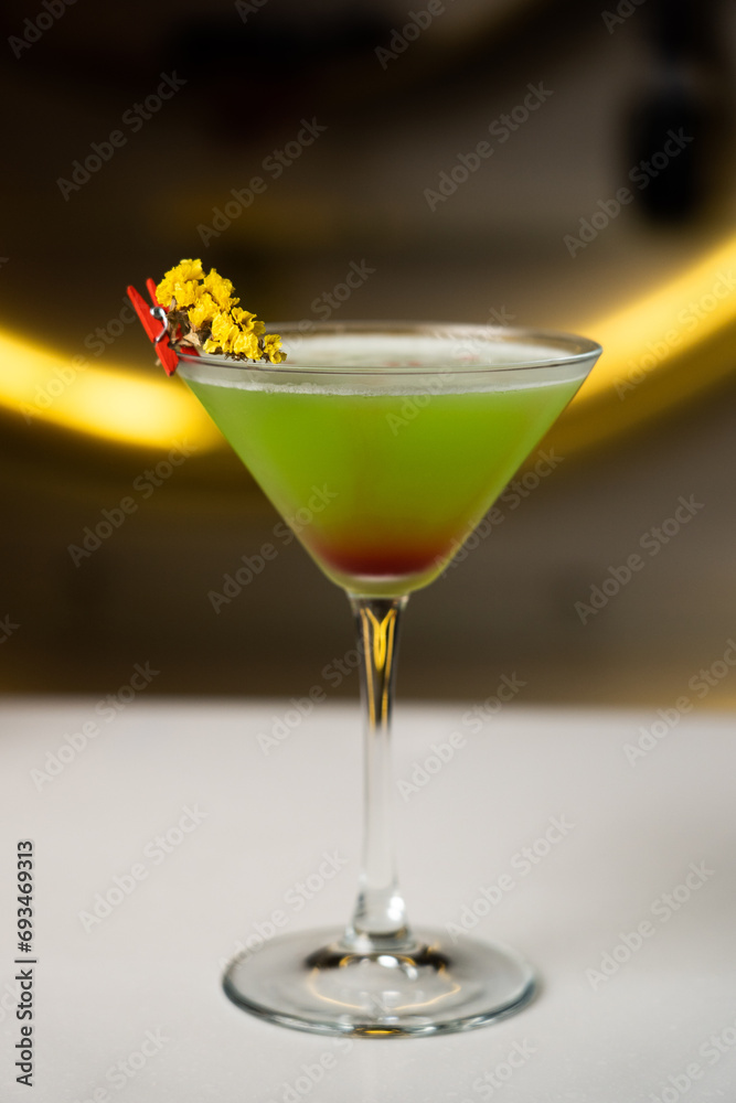 Alcoholic cocktail on a black background. Concept of cocktails and alcohol