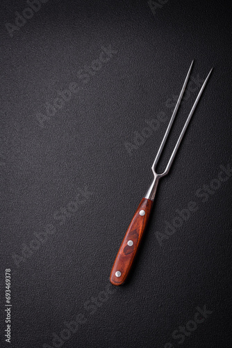 Kitchen knife and fork made of steel with copy space