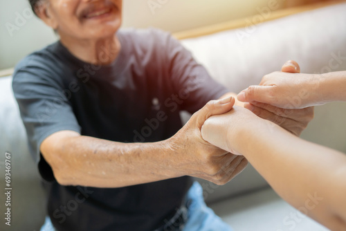Professional specialist doctor support encourage retired older man patient holding his palms. photo