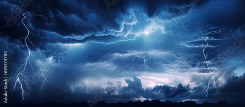 Dramatic clouds at night with lightning and thunder. photo