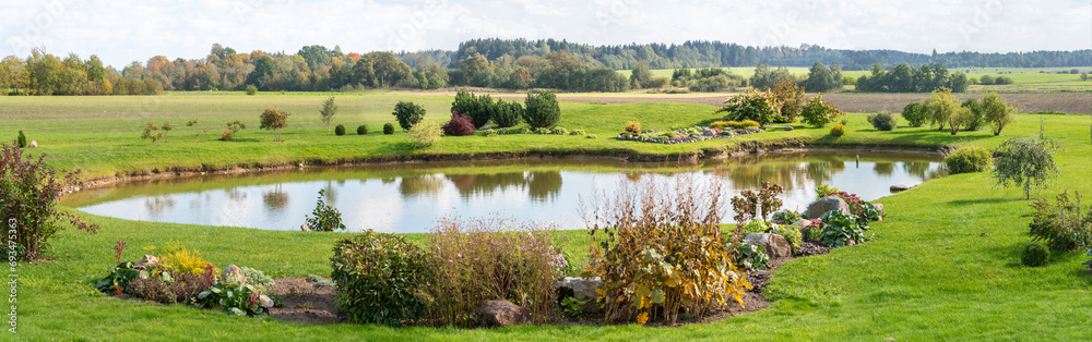 Fototapeta premium Beautiful landscape with pond, meadow and trees