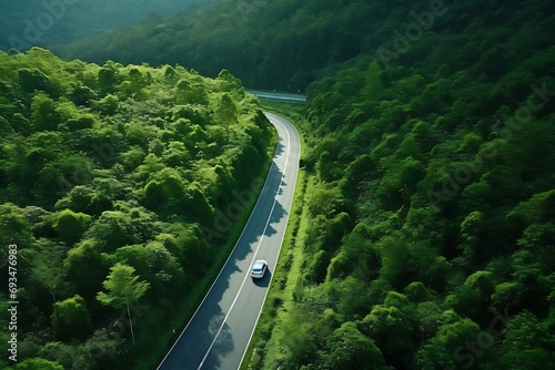Aerial view of highway in the forest. Top view from drone.
