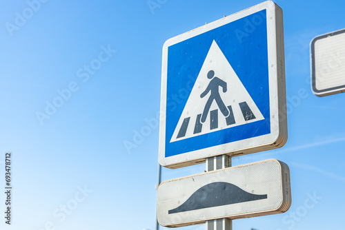 Speed bump and pedestrian crossing sign