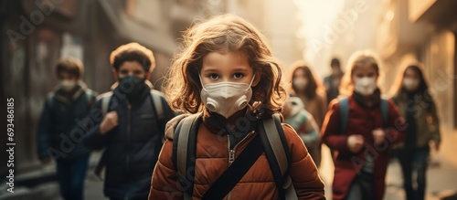 Children returning to school amidst the pandemic, with one wearing a protective face mask.