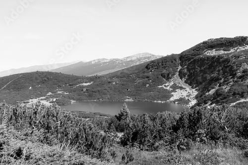 Lake view during the summer season at the Seven Rila Lakes tourist attraction near Sofia, Bulgaria in black and white
