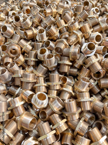 Brass plumbing fittings in a heap