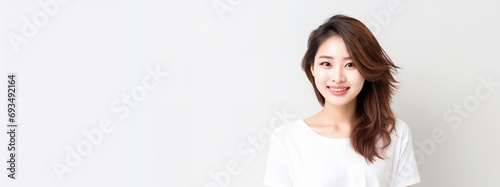 Backdrop of a young smiling happy woman, copy space