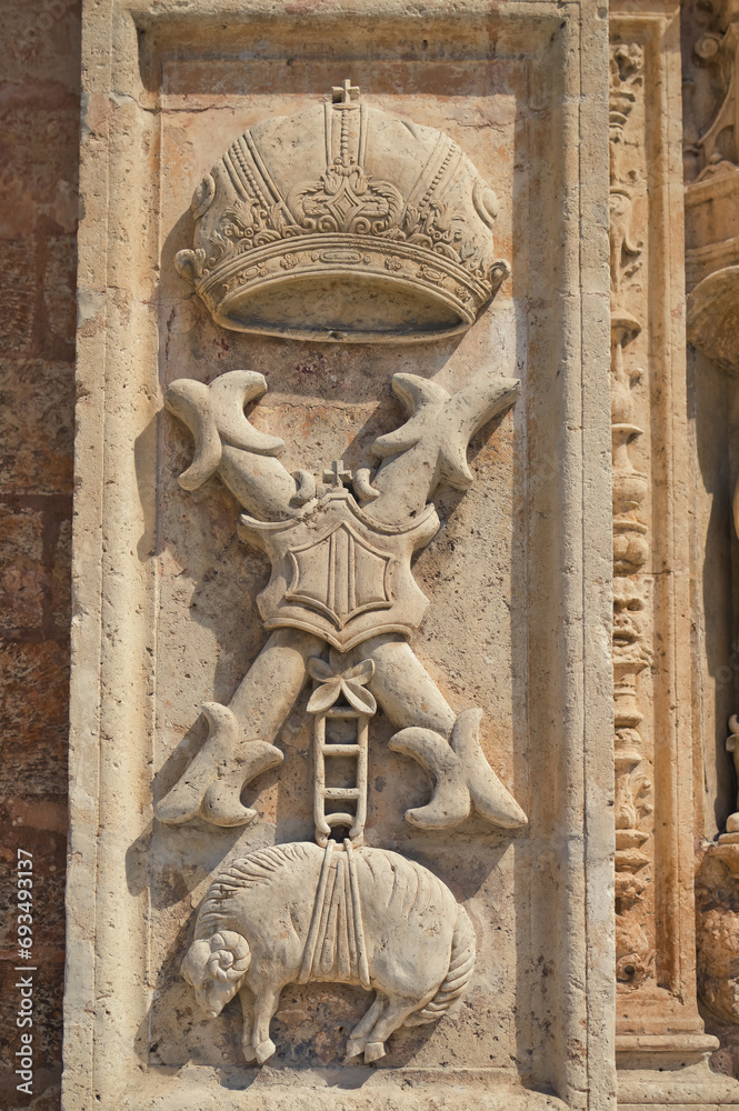 Religious sculptures at outer wall of catholic church.