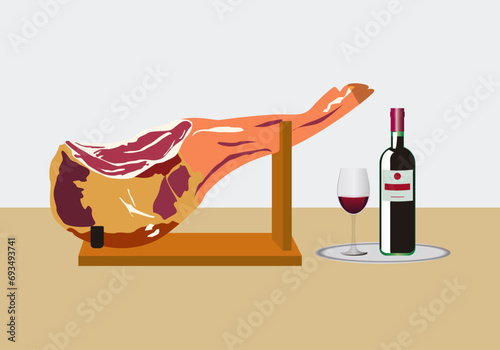 Pata de jamón ibérico o serrano sobre un jamonero y una botella de vino tinto con una copa. Alimentos y bebidas. Lux. Piscolabis. Gastronomía photo