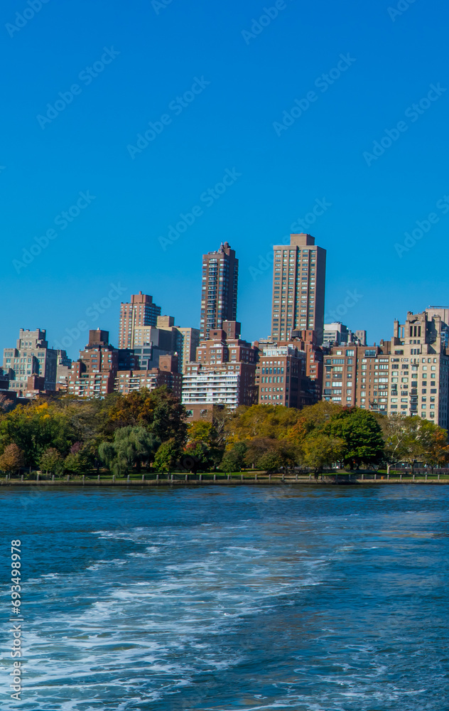 Panoramic view of buildings in central Manhattan New York seen from the East River