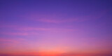 Colorful romantic twilight sky with beautiful pink sunset cloud and orange sunlight on dark blue sky after sundown in evening time, idyllic peaceful nature panoramic background