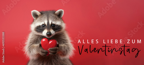 Alles Liebe zum Valentinstag, Grußkarte mit deutschem Text - Niedliche Waschbär hält rotes Herz , isoliert auf rotem Hintergrund © Corri Seizinger