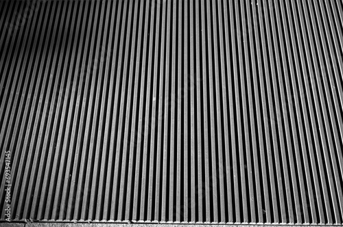 Closeup of Parallel Lines on a Steel Grate.
