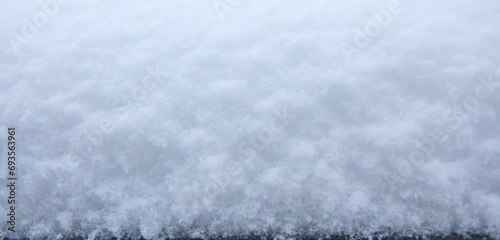 Macro photo of white snow in winter, snow texture.