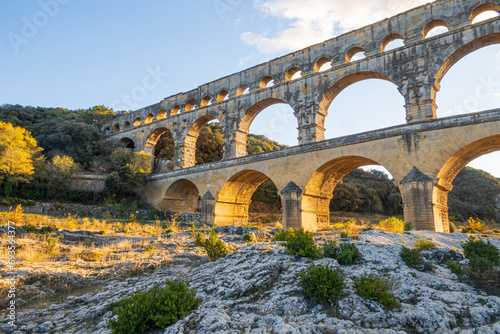 The magnificent Pont du Gard, at setting sun., ancient Roman aqueduct bridge. Photography taken in Provence, southern France photo