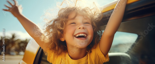 Happy children stretches her arms while sticking out car window. Lifestyle, travel, tourism, nature..family, travel, children, trip, journey, transportation