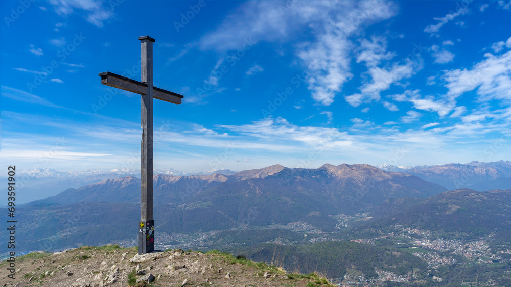 Cross at the top of a mountain in the Swiss Alps Cross at the top of a mountain in the Swiss Alps