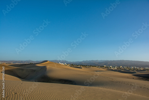 Sand dunes of Maspalomas with a view of the city on Gran Canaria  Spain