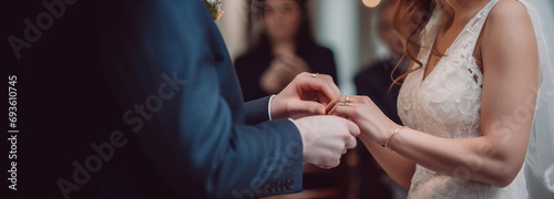 Wedding hands of the bride and groom ceremonially put wedding rings on their fingers. AI generated. photo