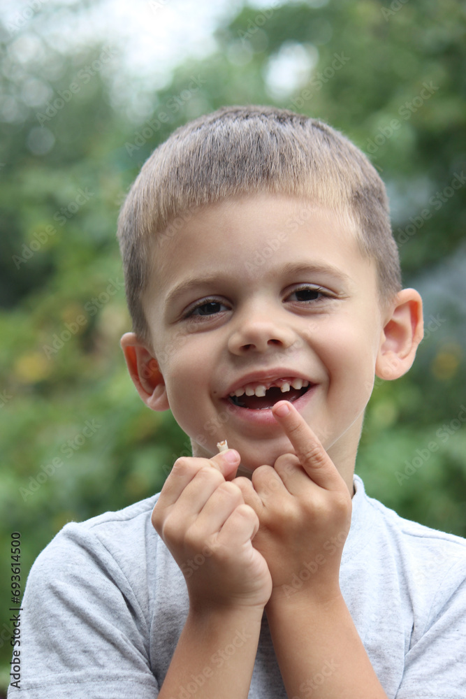 The child lost a tooth. Selective focus.Concept baby tooth The child lost a tooth. Selective focus.Concept baby tooth