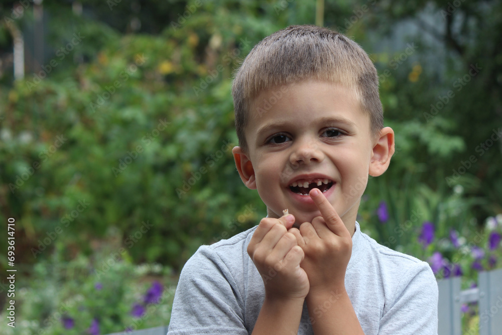 The child lost a tooth. Selective focus.Concept baby tooth The child lost a tooth. Selective focus.Concept baby tooth