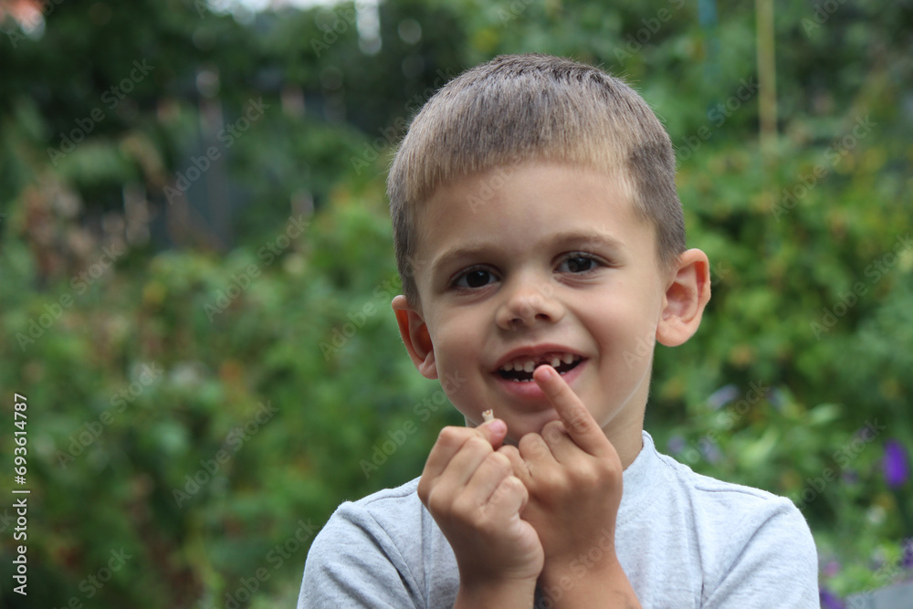 The child lost a tooth. Selective focus.Concept baby tooth The child lost a tooth. Selective focus.Concept baby tooth