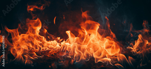 vertical shot of beautiful burning flames at night-