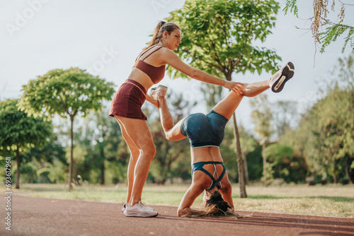 Fit girls display strength, flexibility, and balance while working out. Inspiring, active young adults embracing a healthy lifestyle with upside-down headstand poses and full-body training.