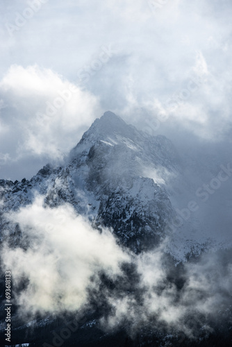 Lonelny Mountain in the clouds Covered in snow Winter Landscape Nature Polana Rusinowa Tatra Mountains
