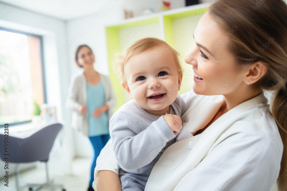 A pediatrician examining a smiling child in a clinic A pediatrician examining a smiling child in a clinic