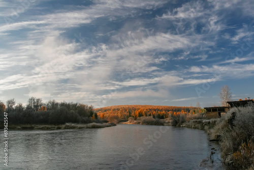 Autumn landscape on frosty September morning in the upper reaches of tributary of the Lena River. © okyela