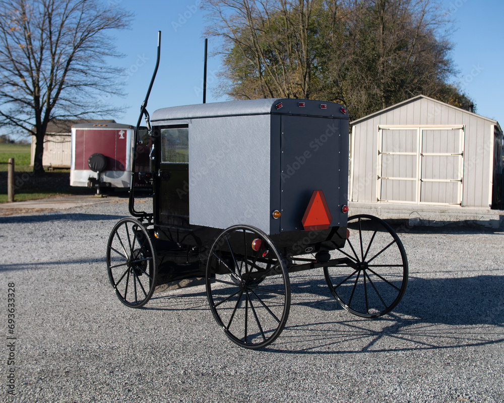 A Rear View of a New Amish Buggy, Parked With Out a Horse, Waiting to be Sold on a Sunny Day