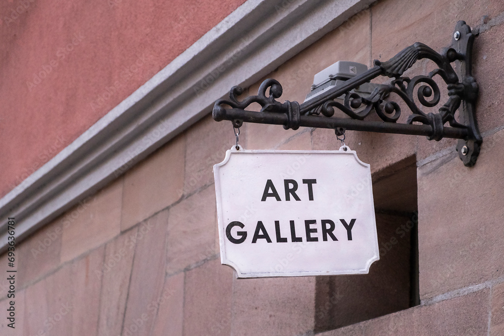 Signboard with the inscription art gallery on a white background on the building Signboard with the inscription art gallery on a white background on the building