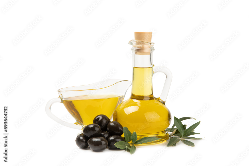 Bottle of fresh olive oil and olives with leaves isolated on white background. Delicious olive oil in a glass bottle. olive oil bottle. Salad dressing. Oil for frying.