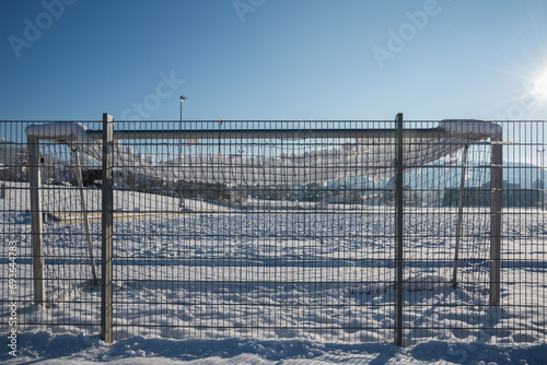 football goal covered with snow in the sun © RenaMiller