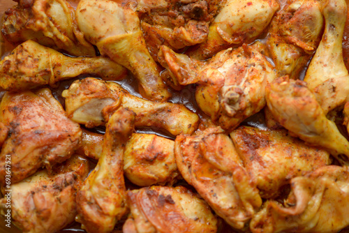 Close-up of seasoned chicken, a mix of herbs and spices.